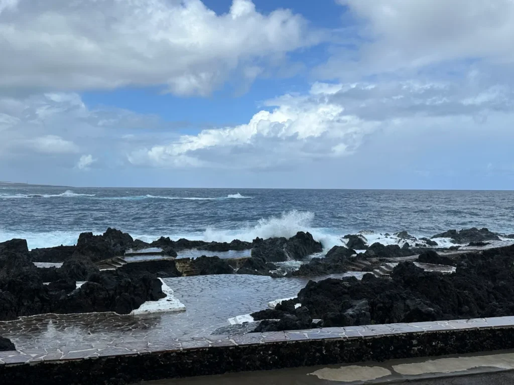 Tenerife travel review, the beautiful natural sea pool with temporary closure gates and ocean waves crashing.