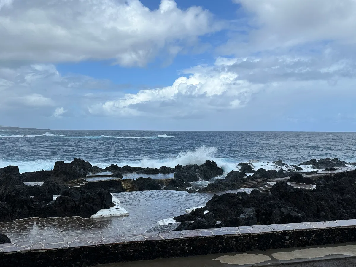 Tenerife travel review, the beautiful natural sea pool with temporary closure gates and ocean waves crashing.